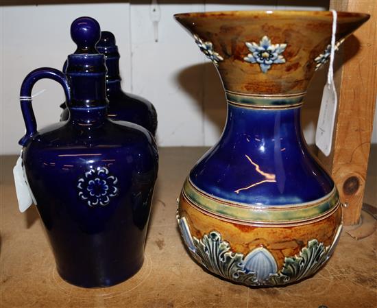 Doulton Lambeth foliate-decorated bulbous vase for Claudius Ash & Sons & a pair of Royal Doulton flagons & stoppers
